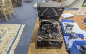 Wind-Up Record Player made by Allan Smith of Southport, in a carry case, with records.