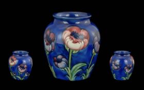 William Moorcroft 1872 - 1945 Signed Bulbous Vase ' Big Poppy ' Design on Blue Ground of Large Form.