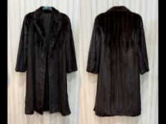 Ladies Full Length Black Mink Coat, collar and reveres, slit pockets, fully lined in sateen fabric.