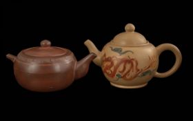 Two Brown Pottery Chinese Teapots with character marks to base.