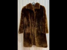 Ladies Dark Brown Beaver Coat, collar, slit pockets, fully lined. Hook and eye fastening.