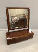 A George III mahogany toilet mirror with rectangular plate on breakfront three drawer box base,