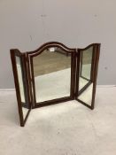 An early 20th century mahogany triple plate toilet mirror, height 67cm. Condition - fair, plate