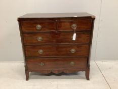 An early Victorian crossbanded mahogany chest of two short and three long drawers, with brass oval