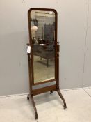 An early 20th century mahogany cheval mirror with moulded frame and reeded down swept legs, width