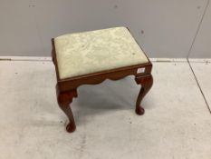A Queen Anne style walnut dressing stool, with shaped frieze and cabriole legs, the drop in seat