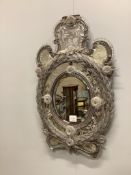 A Venetian wall mirror, width 47cm, height 74cm. Condition - poor to fair, losses to pediment and