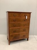 A George III style mahogany chest of two short and four long drawers, veneered fronts with brass