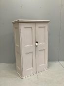 A Victorian painted pine panelled cupboard the interior with three shelves, width 86cm, depth