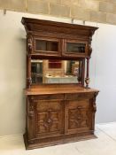 A 19th century Flemish carved oak buffet, width 139cm, depth 54cm, height 214cm. Condition - fair,
