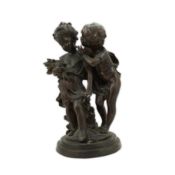 After Auguste Moreau (1834-1917), a bronze group of two putti 'Le secret', on signed naturalistic