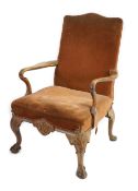 A George II walnut upholstered open armchair with brown velvet upholstered back and seat,