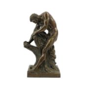 After Edme Dumont (French, 1722-1775), a cast bronze figure of the Milo of Croton ripping apart a
