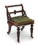 A Regency mahogany harpist chair with foliate motif carved scrolling frame, on turned and fluted