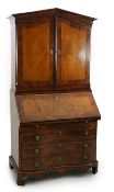 A late 18th century South German walnut bureau bookcase of architectural form, with two doors