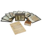 Ten glass slides of Egyptian mummy bandages, a bronze Phallus charm and a display box of three