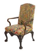 A George II walnut upholstered open armchair with needlework upholstered back and seat, shepherds