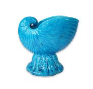 A large Mintons turquoise glazed majolica nautilus shell shaped jardiniere, c.1884, on an integral