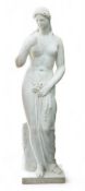 After the Antique, a large 19th century reconstituted marble figure of Venus, standing beside a tree