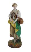 An exhibition size Gille Jeune of Paris enamelled biscuit porcelain figure of a female gardener, mid
