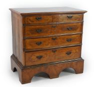A William III inlaid walnut chest, formerly a chest on stand, with geometric veneered top, two short