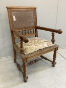 A 19th century French caned elbow chair, width 64cm, depth 61cm, height 104cm. Condition - poor