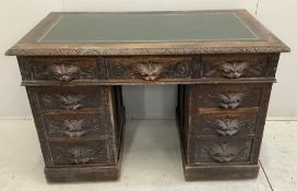 A 19th century Flemish carved oak pedestal desk, width 121cm, depth 65cm, height 80cm. Condition -