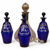 Three Bristol blue decanters and stoppers, ‘Brandy’, ‘Rum’, and ‘Hollands’, a silver mounted