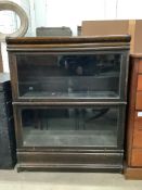 A Globe Wernicke style oak two section bookcase, width 86cm, depth 36cm, height 107cm.Provenance -