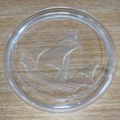 A modern Lalique ashtray decorated with a ship, signed to the base, 17cm in diameter. Condition -