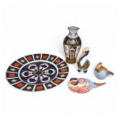 Three Crown Derby paperweights, and an Imari pattern plate and vase, 27cm in diameter. Condition -