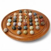 A a large padouk wood solitaire board with hardstone marbles, board 32cm diameter. Condition - good