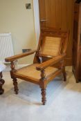 A mid 19th century Anglo Indian teak planter's chair, width 62cm, depth 84cm, height 92cm. Condition