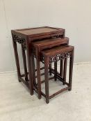 A nest of three rectangular Chinese hardwood tea tables, width 42cm, depth 31cm, height 60cm.