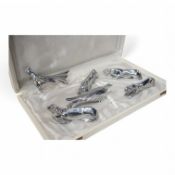 A set of six Art Deco chromed knife rests in the form of stylistic animals, each approximately 9cm