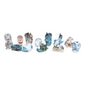 A collection of mostly Rye pottery money boxes in the form of animals together with an abstract
