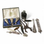 A set of three Soviet white metal cups, boxed, a white metal Torah, a collection of cork screws, a