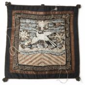 A Chinese 20th century silk embroidered Phoenix rank badge with border. 25cm x 26cm. Condition -