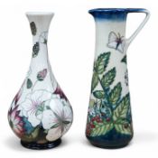 A modern Moorcroft vase, bramble pattern and a jug in the fruit garden pattern by Nicola Slaney,