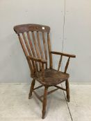 A Victorian elm and beech Windsor lathe back armchair, width 57cm, depth 46cm, height 112cm.