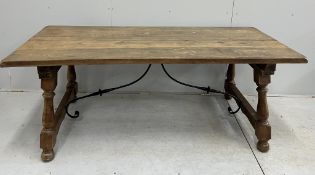 A Spanish style rectangular walnut dining table, width 200cm, depth 88cm, height 77cm. Condition -