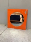 A 1970's orange perspex wall mirror with circular plate, width 60cm, height 60cm. Condition - good