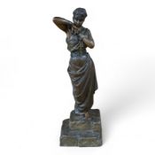 A bronzed spelter figure of a bound woman, signed E. Villanis, 56cm high. Condition - good, chain