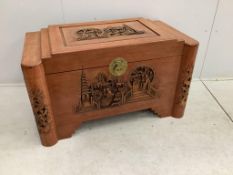 A Chinese carved camphor wood trunk, width 102cm, depth 54cm, height 60cm. Condition - poor, sun