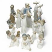 Fifteen Lladro figures or groups, 28cm high. Condition - one child group figure head broken.