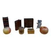 A collection of 19th century treen money boxes, including one in the form of a miniature chest,