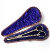 A cased pair of late Victorian silver grape scissors, by William Hutton & Sons, London, 1897, 17.