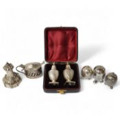 A cased pair of silver pepper pots, Birmingham, 1886, 91mm and five other assorted silver cruets.