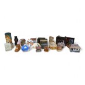 A collection of vintage and later money boxes to include a Quimper pig and Staffordshire style