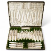 A cased set of six pairs of mother of pearl handles silver fruit eaters and six matching coffee
